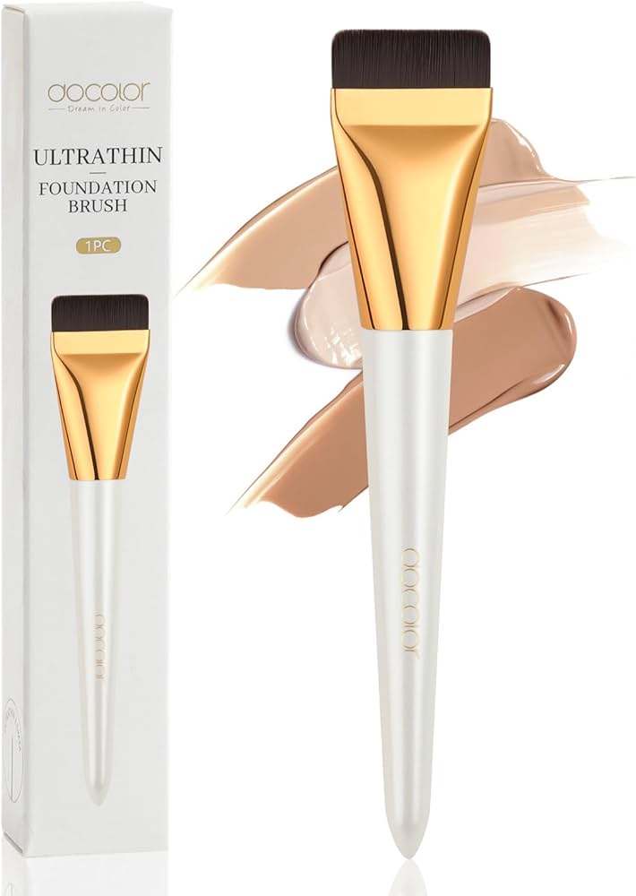 makeup brush applying foundation thin layer