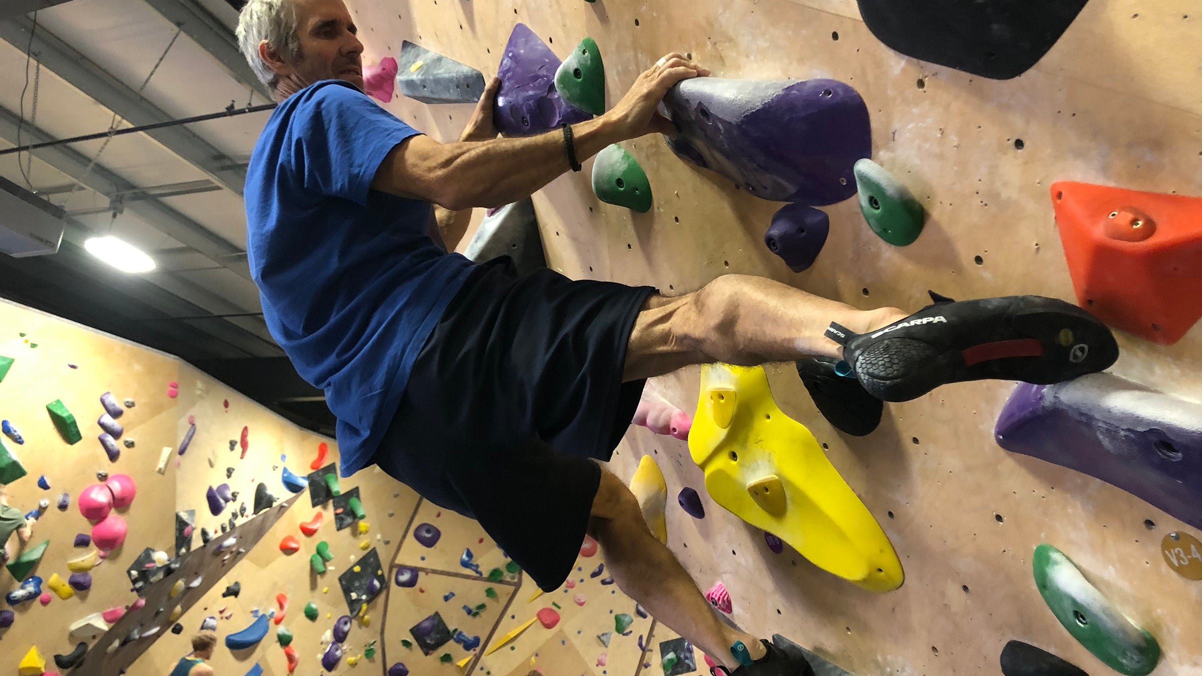 indoor bouldering wall climbing shoes on volumes